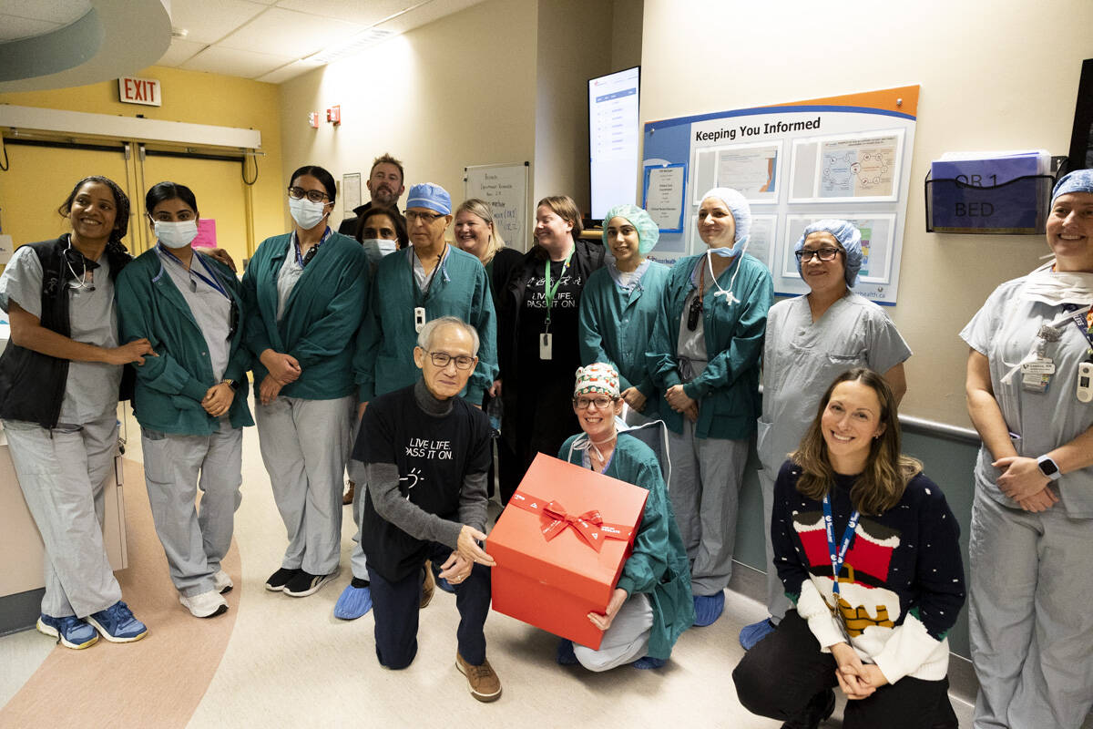 Surrey health workers receiving recognition at an event.